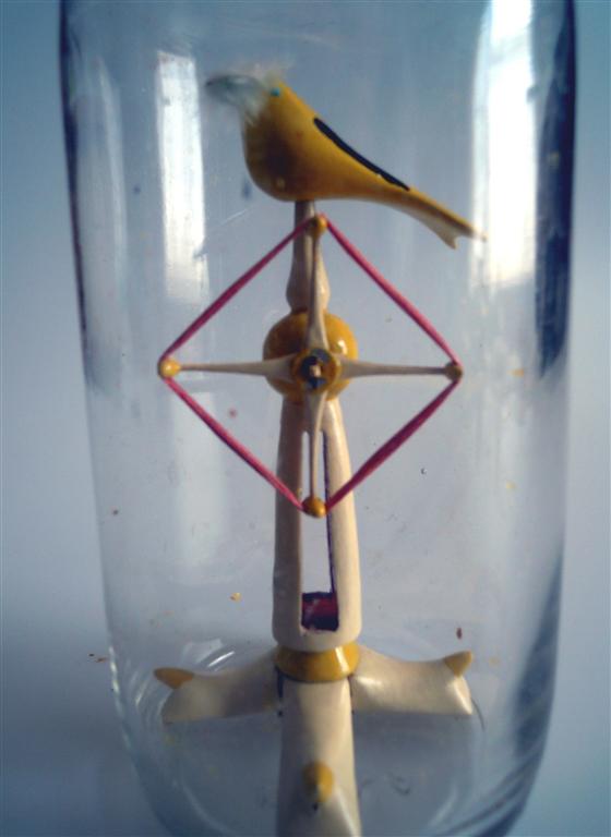 Goldfinch On A Windmill Winder in a Bottle