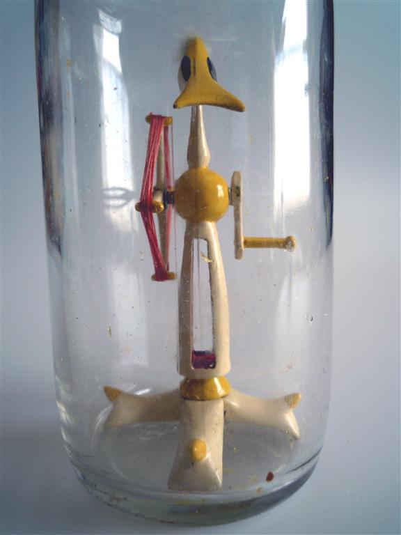 Goldfinch On A Windmill Winder in a Bottle